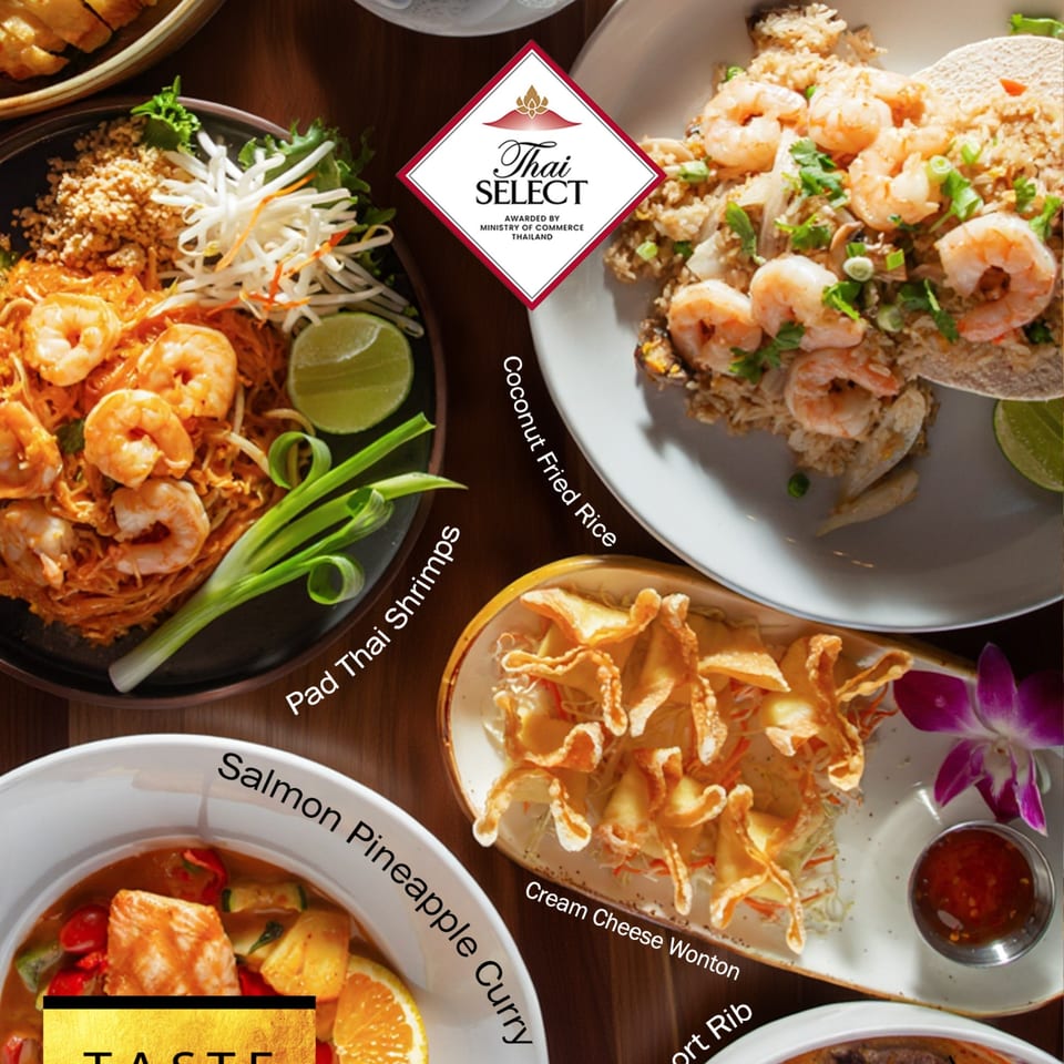A top-down view of various Asian fusion dishes, including Pad Thai, fried rice, wontons, and curry.