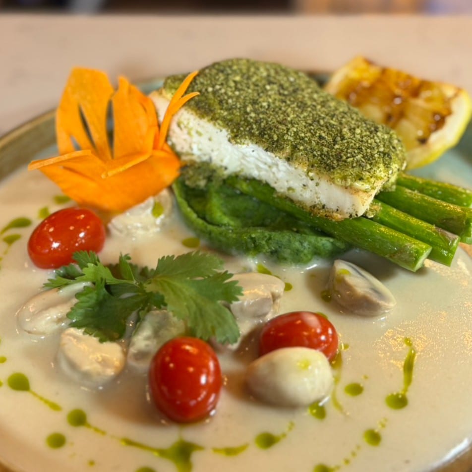 BASIL-CRUSTED HALIBUT IN WHITE COCONUT SAUCE.